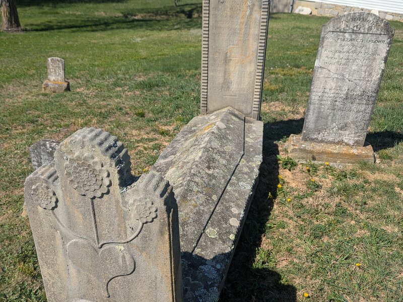 Carved sunflower headstone in the St. John cemetery