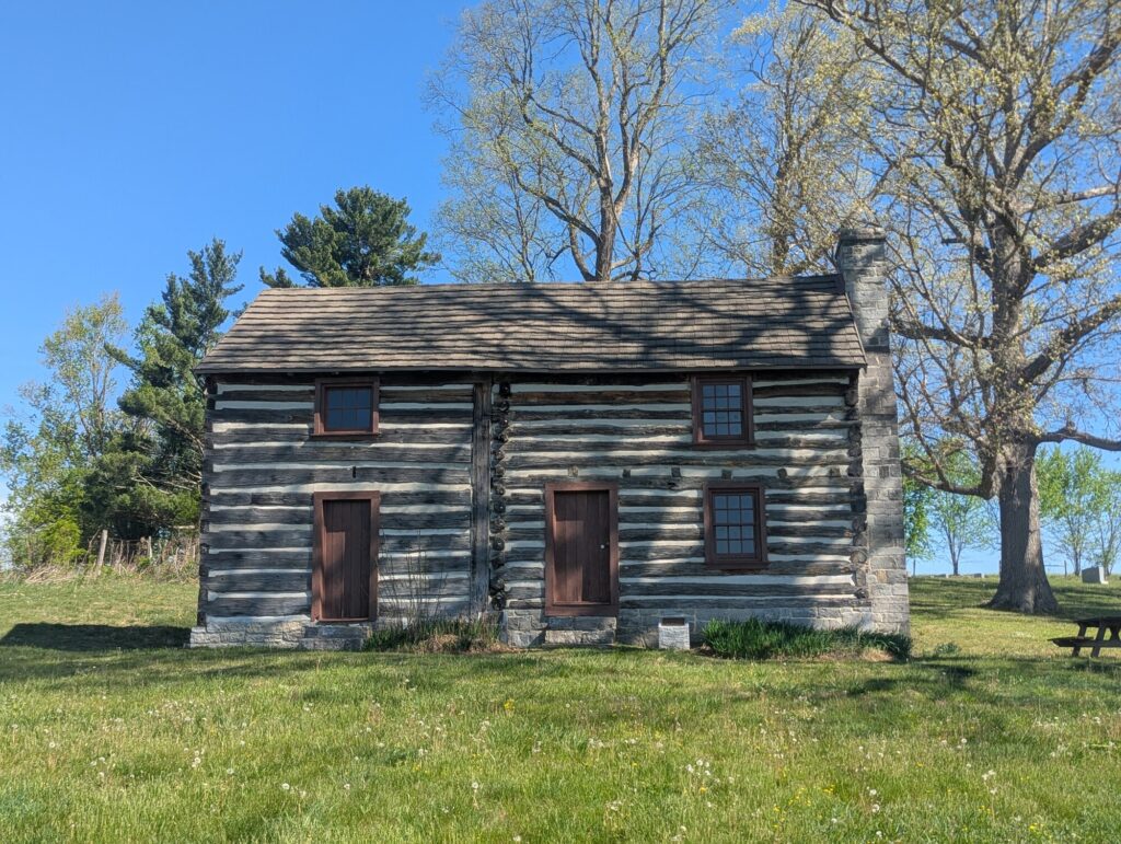 Front elevation of the Flohr House, hewn-log construction with two doors and a central chimney