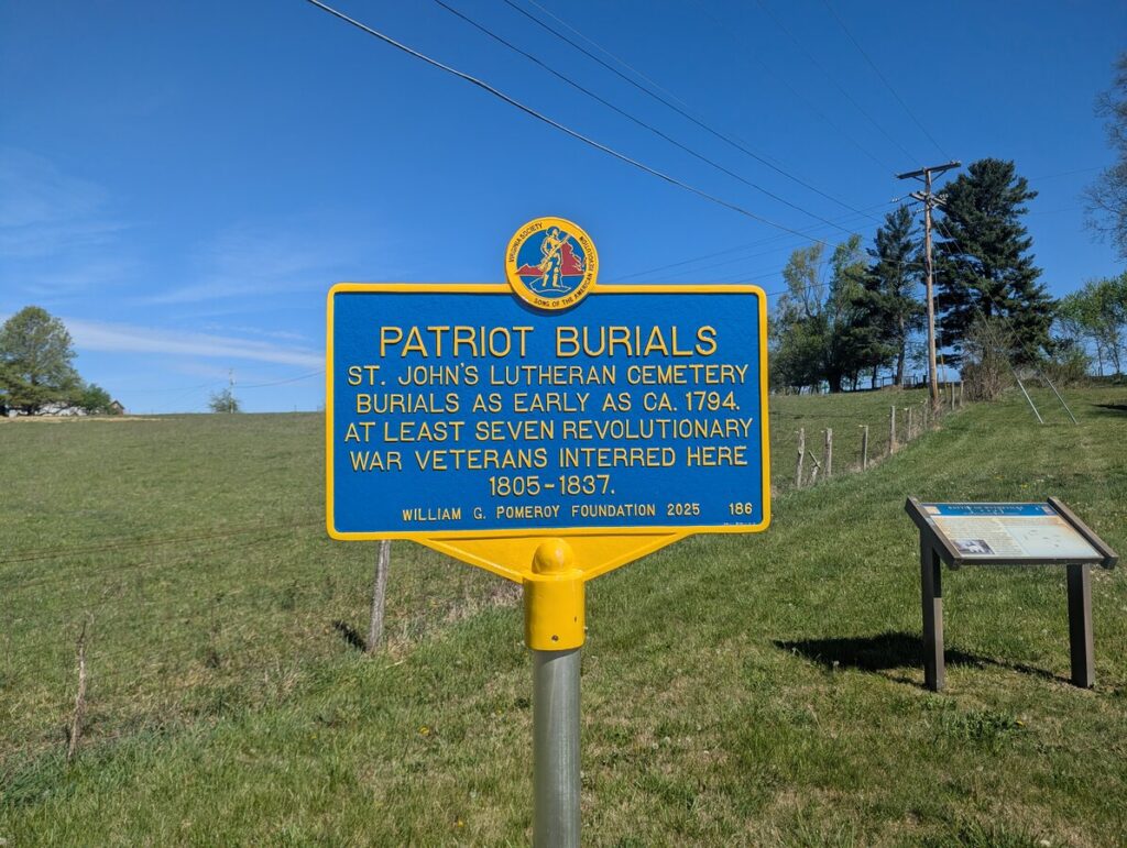 Blue-and-gold William G. Pomeroy Foundation marker reading: PATRIOT BURIALS — St. John's Lutheran Cemetery burials as early as ca. 1794. At least seven Revolutionary War veterans interred here 1805-1837